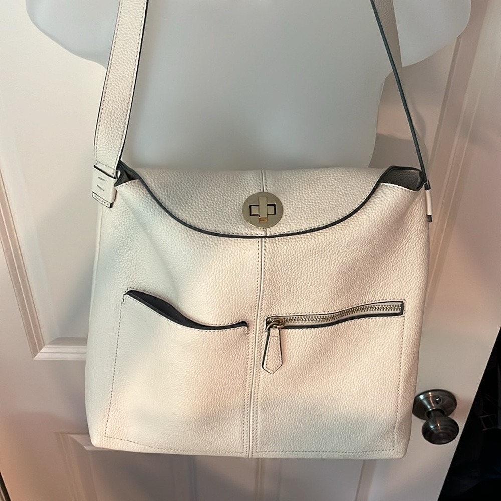Danielle Nicole purse. 14x12 wide. Zipper pockets. Buckle closure.Cream color